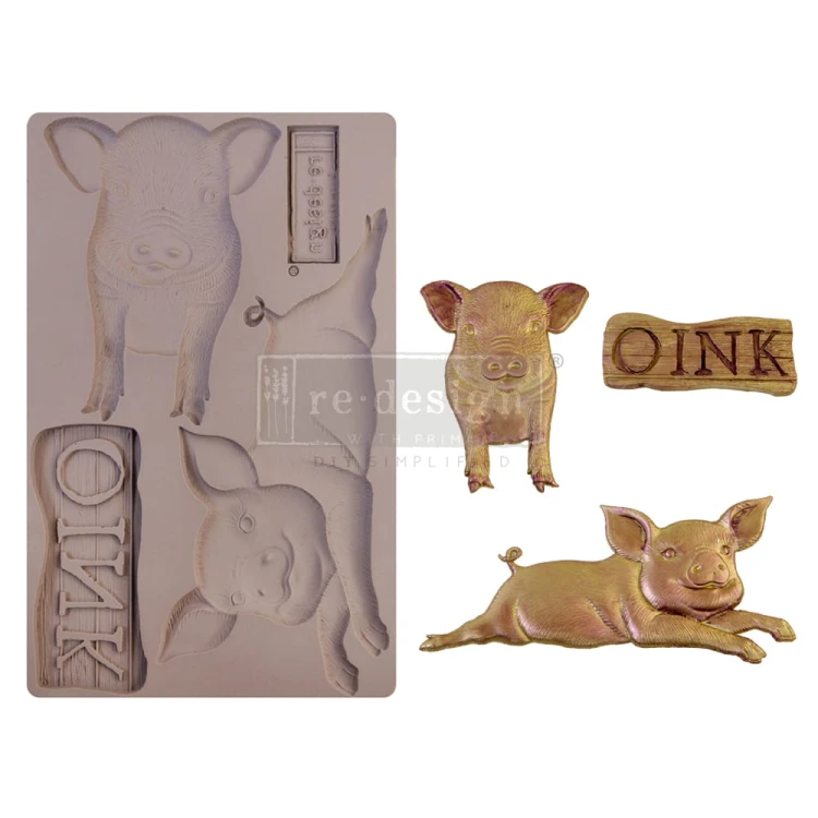 Forma silikonowa do odlewów o wymiarach 20x13 cm -marki Prima Farm Friends. Zawiera wzory dwóch wesołych świnek i szyld z napisem OINK czyli chrumkać.